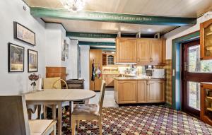 a kitchen with a table and a dining room at 4 Bedroom Stunning Home In Humble in Humble +21 photos