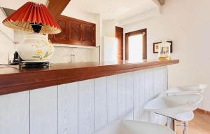 a kitchen with a vase sitting on a counter at Mallorcasita in S'Illot +15 photos