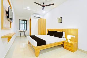 Postel nebo postele na pokoji v ubytování Super Hotel O Raipur