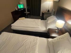 Tempat tidur dalam kamar di Hotel Zlatý Anděl