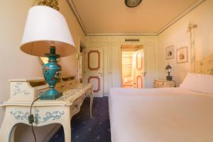 Ένα ή περισσότερα κρεβάτια σε δωμάτιο στο DB Villas Le Ville del Lido Resort