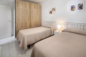 Ένα ή περισσότερα κρεβάτια σε δωμάτιο στο Casa Santo front beach