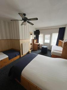 Postel nebo postele na pokoji v ubytování Hotel Breitner