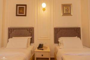 Postel nebo postele na pokoji v ubytování El Farida Hotel + 37 fotografií