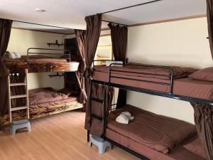 Postel nebo postele na pokoji v ubytování Guest house mochilero onomichi