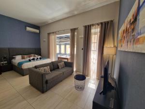 Postel nebo postele na pokoji v ubytování D Townhouse Boutique Suites