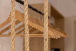 a piece of wood hanging from ropes at MKproperties in Volos