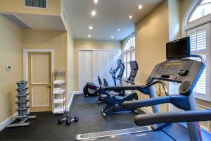 a gym with two treadmills and two ellipticals at Hotel Mazarin in New Orleans