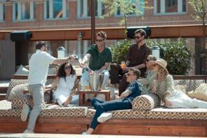 a group of people sitting on a bench at Jacy'z Hotel & Resort in Gothenburg