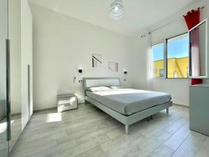 Postel nebo postele na pokoji v ubytování La Corte di Nonna Gina