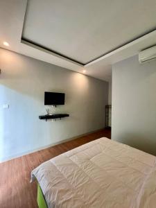 Postel nebo postele na pokoji v ubytování Makarma Resort Lombok