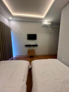 Postel nebo postele na pokoji v ubytování Makarma Resort Lombok