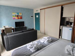 Postel nebo postele na pokoji v ubytování D Townhouse Boutique Suites