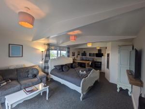 a living room with a bed and a couch at The Viewpoint in Deal