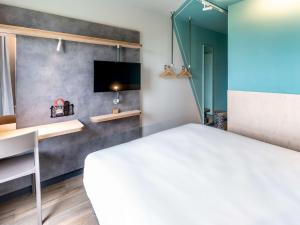Postel nebo postele na pokoji v ubytování ibis budget Morlaix