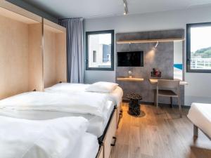Postel nebo postele na pokoji v ubytování ibis budget Morlaix
