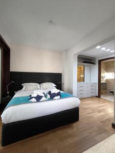 Postel nebo postele na pokoji v ubytování D Townhouse Boutique Suites
