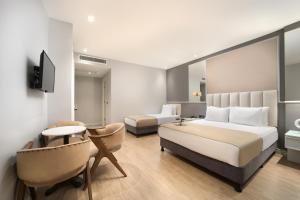 Postel nebo postele na pokoji v ubytování Ess Hotel