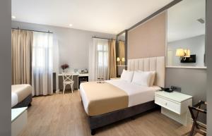 Postel nebo postele na pokoji v ubytování Ess Hotel