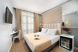 TV a/nebo společenská místnost v ubytování Ess Hotel