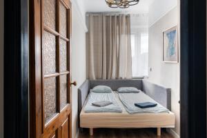 Posteľ alebo postele v izbe v ubytovaní Blue Apartment Rajska