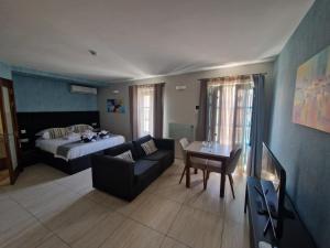 Postel nebo postele na pokoji v ubytování D Townhouse Boutique Suites