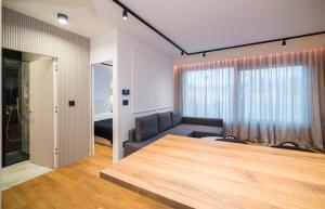 Postel nebo postele na pokoji v ubytování Apartment Legacy + 18 fotografií