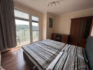 Posteľ alebo postele v izbe v ubytovaní Apartmán Zmeko Centrum Piešťany + 12 fotografií