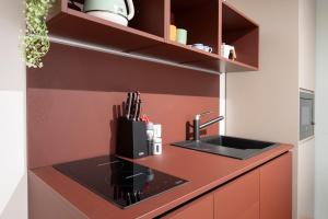 a kitchen with a sink and a counter top at Cavalletto Suite in Venice