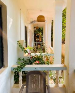 a table and a chair in front of a mirror at SPACELAND Mandrem in Mandrem