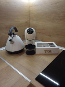 a coffee maker sitting on top of a wooden counter at Luxury apartment in Teteven