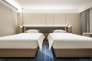 Φωτογραφία από το άλμπουμ του Echarm Hotel Du'an High-speed Railway Station σε Du’an +16 φωτογραφίες