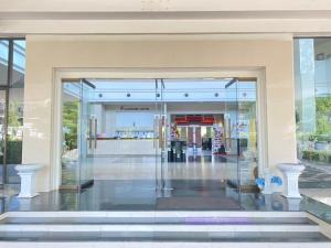 an entrance to a shopping mall with a glass door at Fortune Hotel Korat- SHA Plus in Nakhon Ratchasima