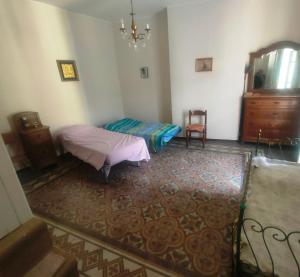 a bedroom with a bed and a dresser in a room at Vannelli Rooms in Castelbottaccio +31 photos