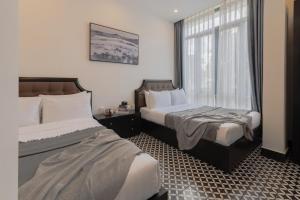 Postel nebo postele na pokoji v ubytování Tân Villa 2 Đà Lạt + 37 fotografií