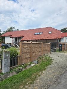 a wooden fence in front of a house at U maďarčika in Prituľany