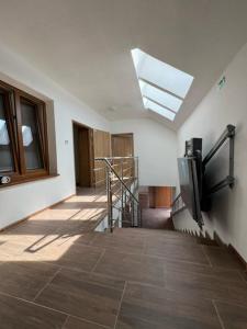 a hallway with a skylight and a staircase in a building at U maďarčika in Prituľany