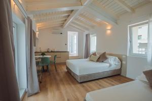 Postel nebo postele na pokoji v ubytování Garda Relais