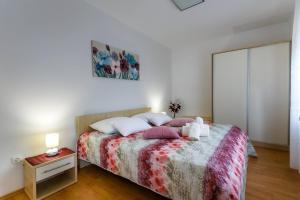 Postel nebo postele na pokoji v ubytování Apartments Paradiso