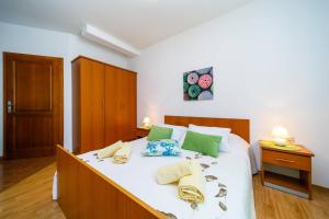 Postel nebo postele na pokoji v ubytování Apartments Paradiso