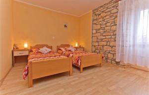 Postel nebo postele na pokoji v ubytování Holiday Home Peresiji I