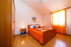 Postel nebo postele na pokoji v ubytování Apartments Paradiso