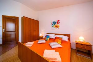 Postel nebo postele na pokoji v ubytování Apartments Paradiso