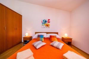 Postel nebo postele na pokoji v ubytování Apartments Paradiso