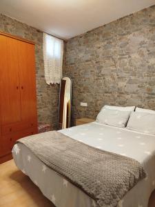 A bed or beds in a room at Apartamento Plano Royo 2º