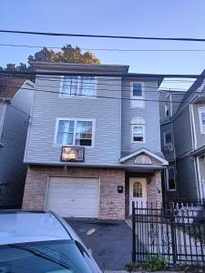 a house with a car parked in front of it at Fada Guest House - 38 Yates Ave Newark in Newark