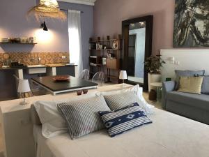 a living room with a couch and a table at CasapiuHolidaySicilia - Adults Only in Noto