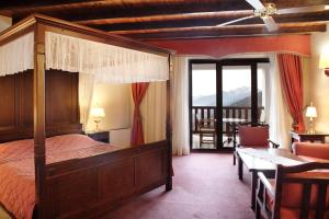 Postel nebo postele na pokoji v ubytování HOTEL SPA MONTANA