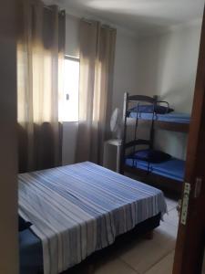 Postel nebo postele na pokoji v ubytování Cascais Quartos & Suítes