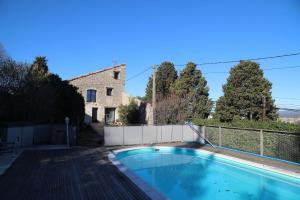 a swimming pool in front of a house at Sète, Villa Clara maison 5 étoiles avec piscine in Sète